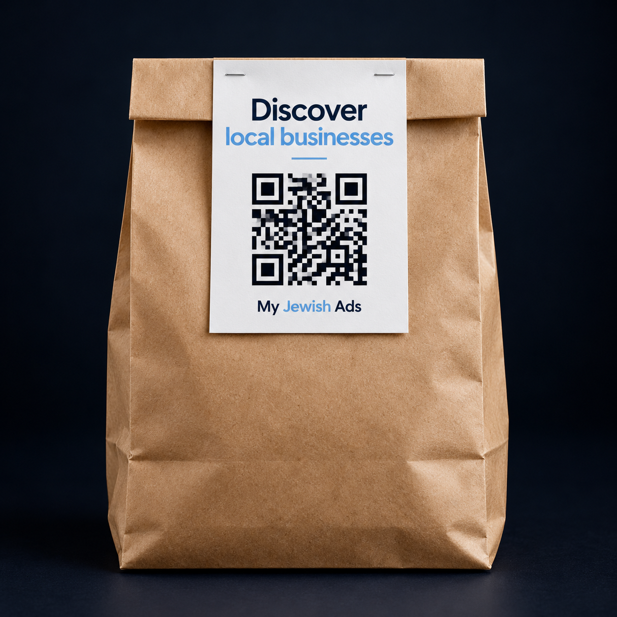 A takeout bag with a stapled QR code flyer promoting the My Jewish Ads Business Finder